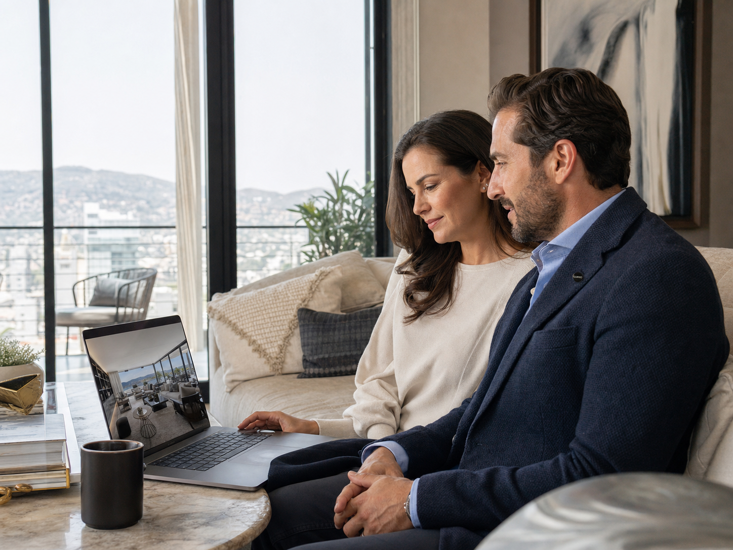 Couple exploring a virtual tour of a property on a laptop